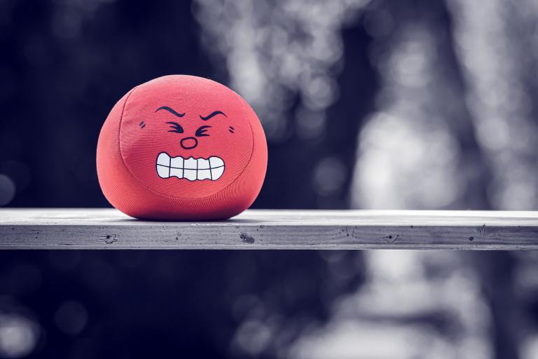 Picture of a red ball with an angry face.