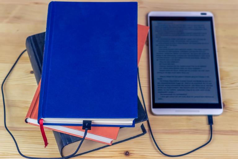 Image of books and an ebook reader