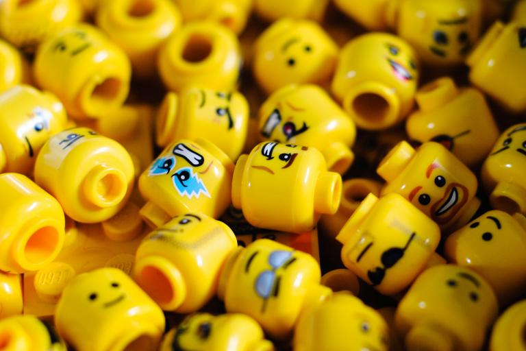 Many yellow Lego heads with different expressions.
