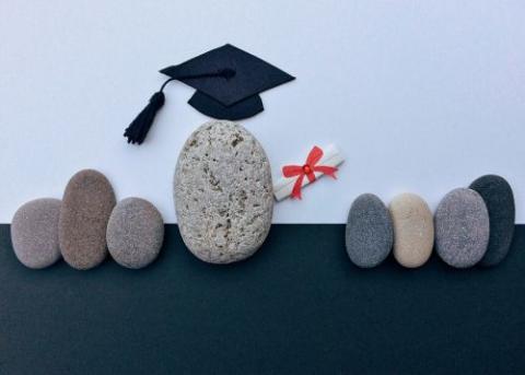 pebbles dressed as graduating students